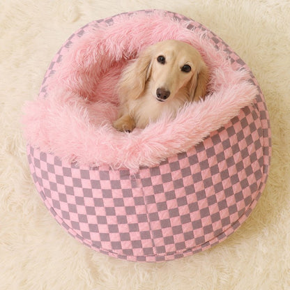 Dachshund peeking out of the pink Hooded Dachshund Donut Bed, top view
