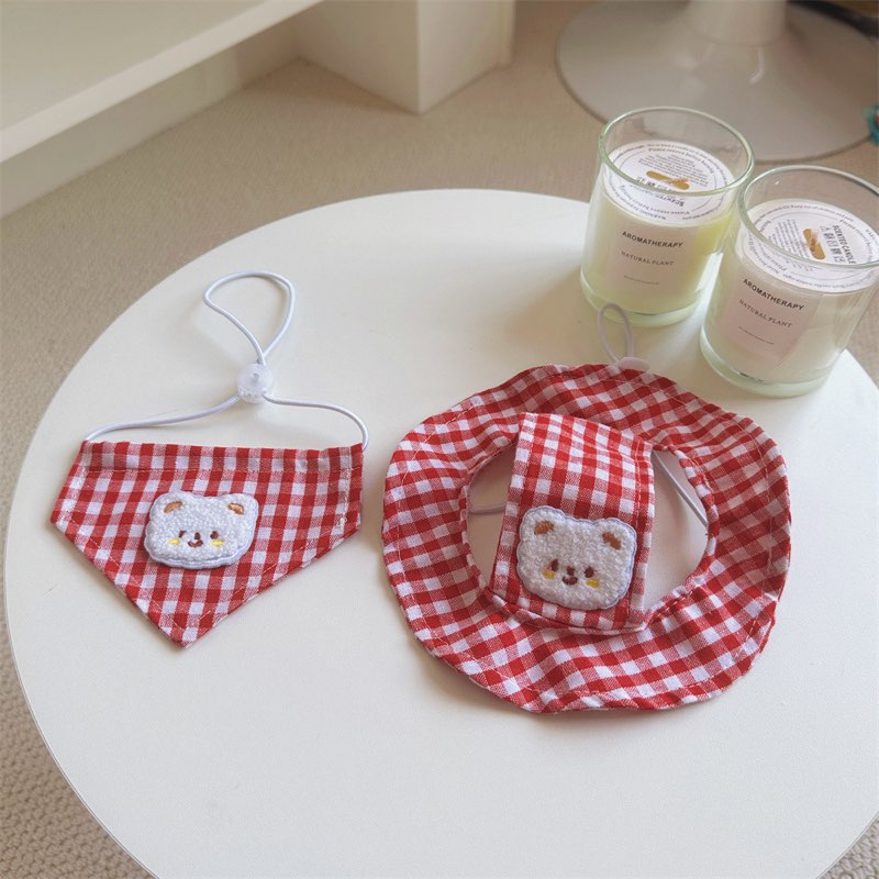 Red plaid dachshund sun hat and bandana set flat lay