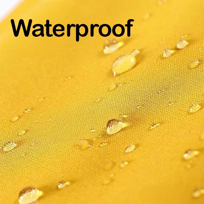 Waterproof fabric closeup with water beading on yellow surface